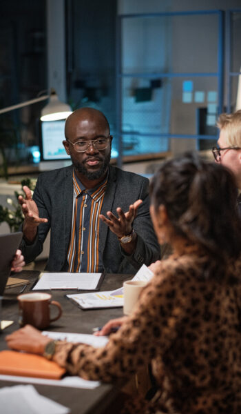 Motor Industry Ombudsman of South Africa - About Us - business people sitting at meeting 2025 02 11 15 50 17 utc