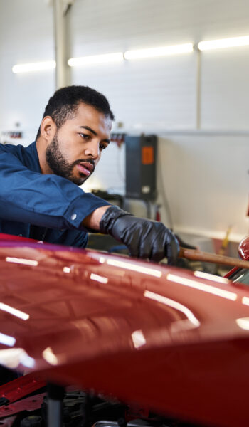 Motor Industry Ombudsman of South Africa - About Us - young mechanic skillfully repairing a car in a mod 2025 01 06 19 56 40 utc