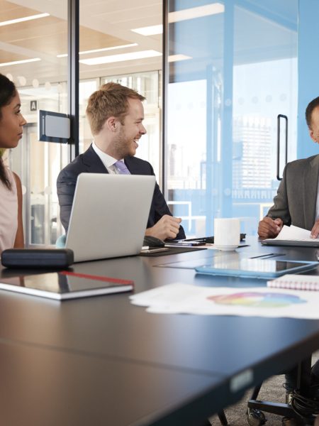 Young professional colleagues at business meeting, close up